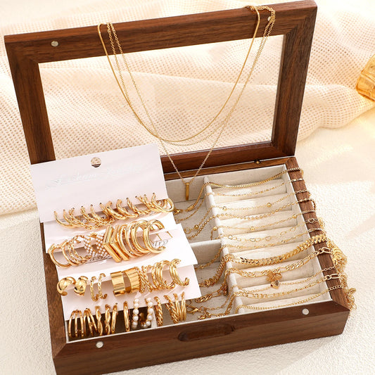 37-piece boho gold jewelry set in a wooden box with layered necklaces, earrings, bracelets, and anklets