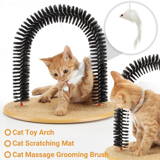 Orange tabby cat playing with an interactive arch toy featuring a self-grooming brush, scratching mat base, and hanging plush mouse.