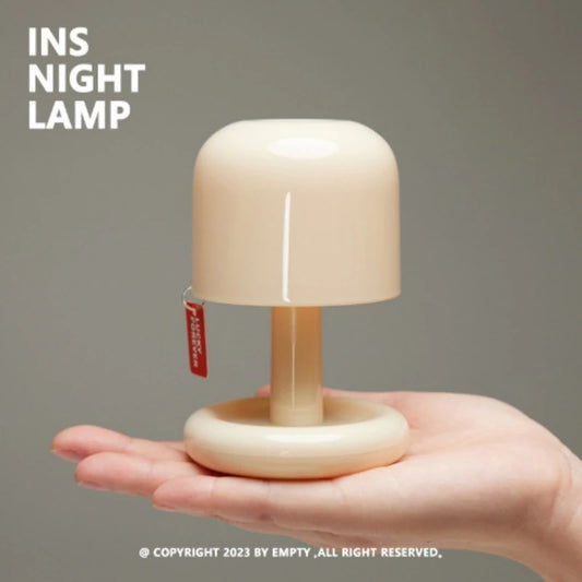 Mini sunset mushroom night light with warm LED glow held in a hand, ideal for cozy bedroom or aesthetic decor