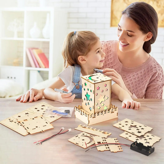 Mother and daughter assembling a wooden star nightlight from a 5-in-1 STEM puzzle kit for kids