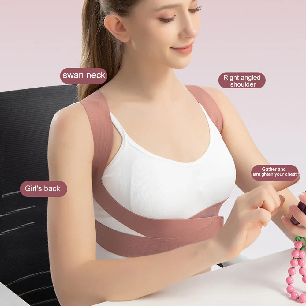 Woman wearing pink adjustable posture corrector while sitting at desk, showing ergonomic shoulder and chest alignment