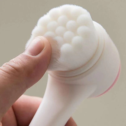 Close-up of hand pressing soft bristles on white silicone face brush – gentle cleansing tool with ultra-soft texture for sensitive skin by BeTrendy
