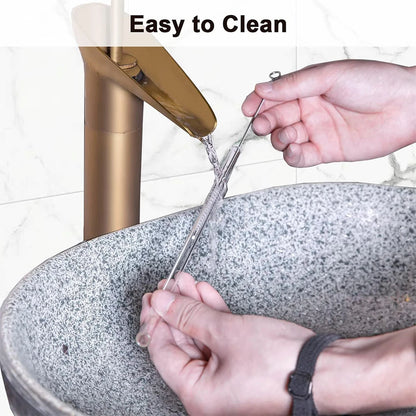 Person rinsing reusable glass straw with cleaning brush under running water – easy-to-clean eco-friendly straw by BeTrendy