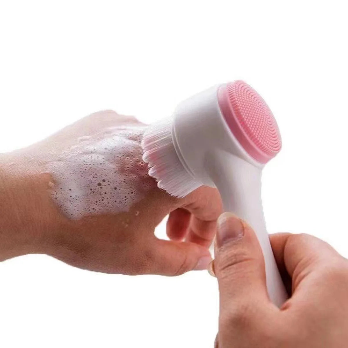 Double-sided silicone face brush with soft bristles being used to lather and cleanse hand skin – gentle exfoliating tool for skincare routine by BeTrendy