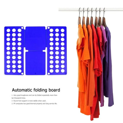 Automatic folding board next to neatly folded and color-organized shirts on hangers, showcasing garment organization and board durability