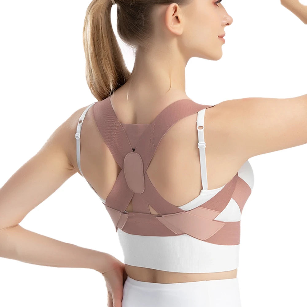 Back view of woman wearing pink adjustable posture corrector with cross-strap design for shoulder and spine support