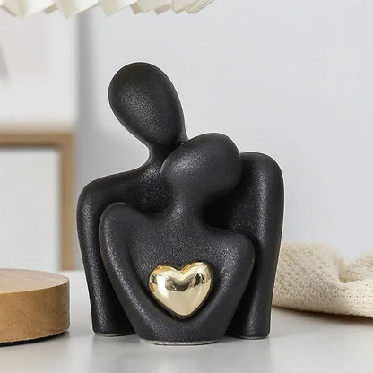 Elegant black ceramic couple figurine holding gold heart, perfect for romantic home decor or meaningful gift