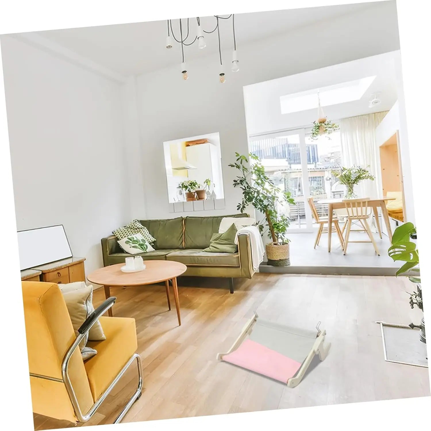 Window-mounted cat hammock bed placed in a stylish living room with natural light and modern decor.