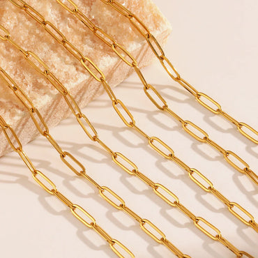 Close-up of minimalist gold paperclip chain links with smooth PVD finish – waterproof stainless steel jewelry detail