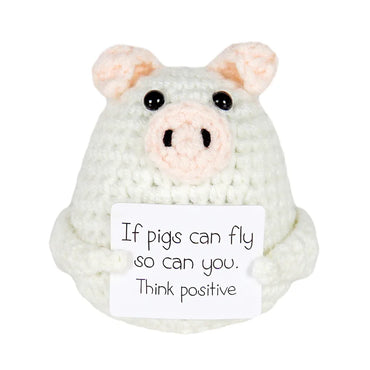 Handmade crochet pig doll holding a sign that says 'If pigs can fly so can you. Think positive' — cute motivational gift or decor piece