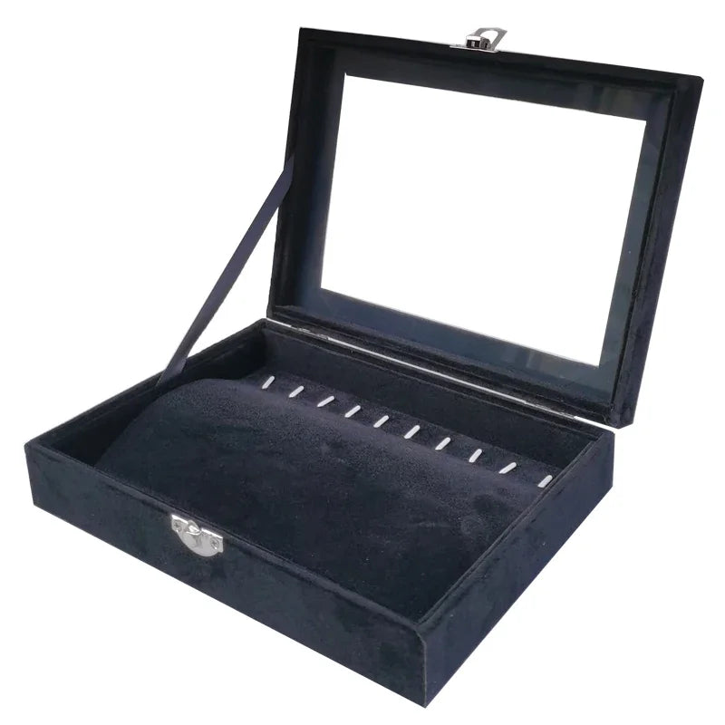 Empty black velvet necklace display case with clear lid and ring slots for jewelry organization