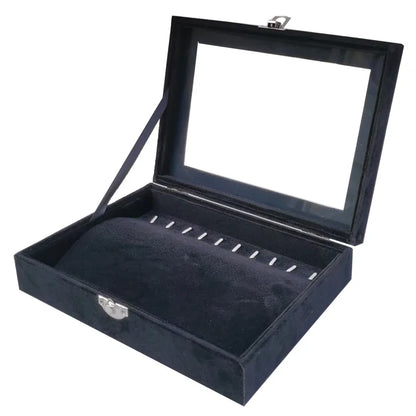 Empty black velvet necklace display case with clear lid and ring slots for jewelry organization