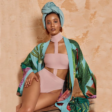 Japanese-style kimono with blue trim styled over pink bikini with turban headwrap
