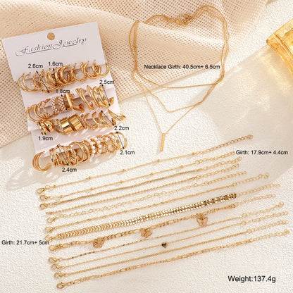 Gold jewelry set with labeled measurements of earrings, necklaces, and bracelets in centimeters and total weight shown Boho BeTrendy