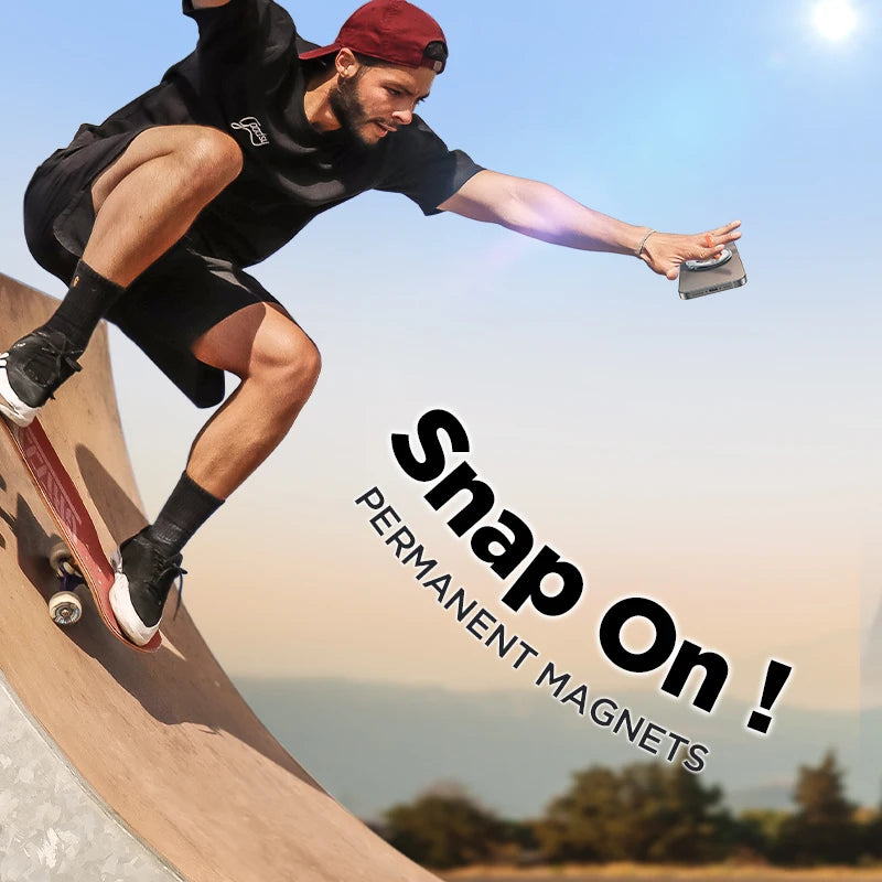 Man skateboarding while holding a phone with a Joyroom magnetic ring holder, showcasing strong snap-on grip with permanent magnets in motion