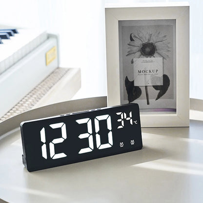 LED digital alarm clock on a desk with large display and temperature reading, ideal for bedroom or home office BeTrendy
