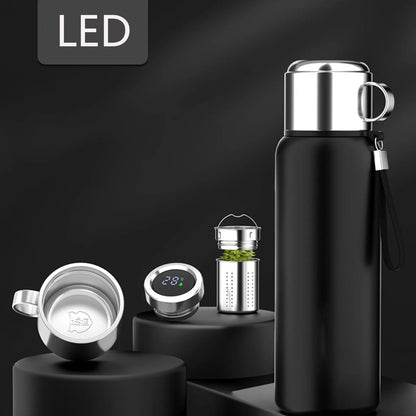 Smart LED thermos bottle set with tea infuser, digital temperature lid, and stainless steel cup on black display. BeTrendy