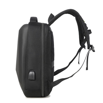 Side profile of a hard-shell laptop backpack showing thickness, structure, and USB charging port.
