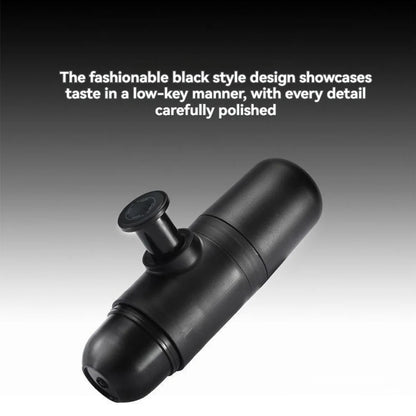 Sleek black portable espresso coffee maker with polished finish, featuring a manual press piston on a gradient black-to-white background