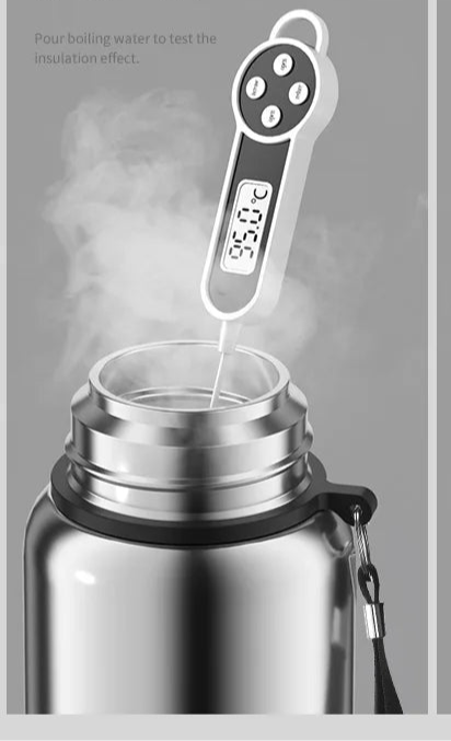 Testing smart thermos insulation with digital thermometer and steam from boiling water