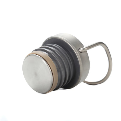 titanium bottle cap with silicone sealing ring and carrying handle for leakproof performance
