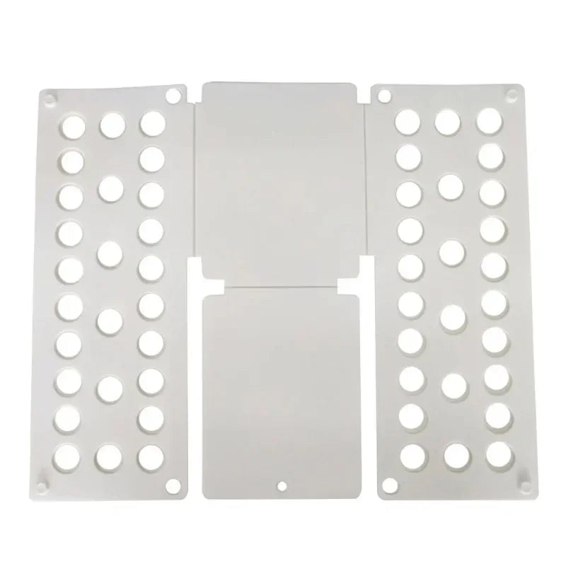 Flat layout of white plastic clothes folding board with ventilation holes for efficient garment folding