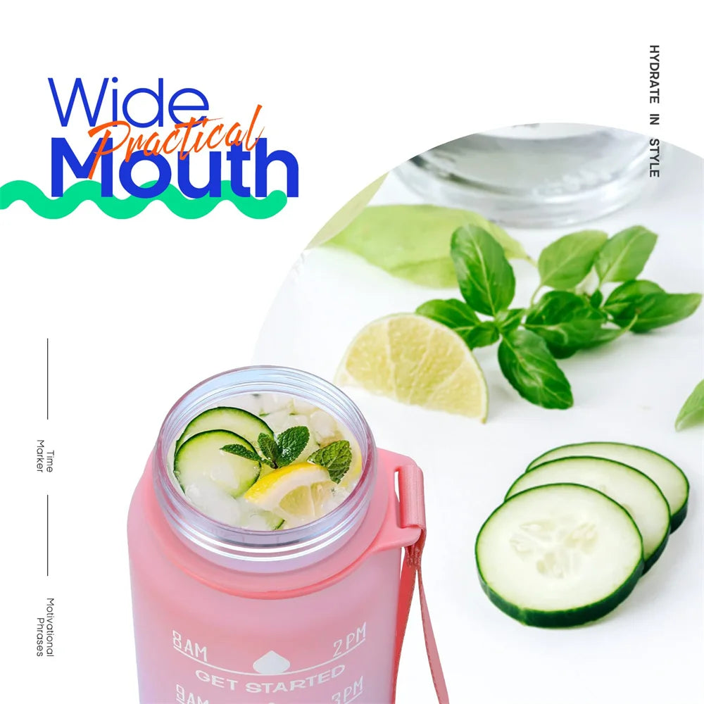 Wide mouth pink water bottle with lemon, cucumber, mint, and ice for infused hydration
